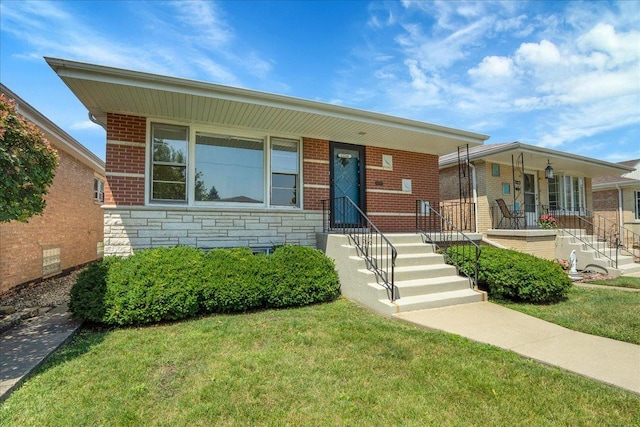 11340 S Drake Ave, Chicago, IL 60655 - view of front of home with a front yard, stone siding, covered porch, and brick siding