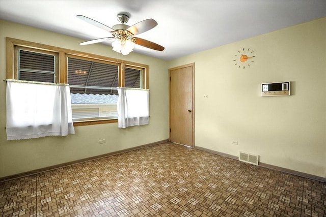 11340 S Drake Ave, Chicago, IL 60655 - empty room with a ceiling fan and baseboards