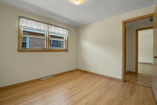 11340 S Drake Ave, Chicago, IL 60655 - empty room with wood finished floors and baseboards