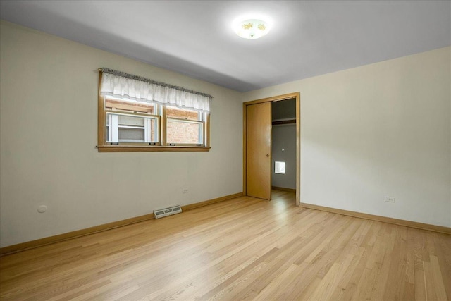 11340 S Drake Ave, Chicago, IL 60655 - unfurnished bedroom with light wood finished floors and a closet