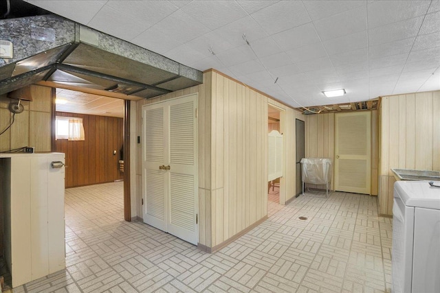 11340 S Drake Ave, Chicago, IL 60655 - basement featuring washer / dryer, brick patterned flooring, and wood walls