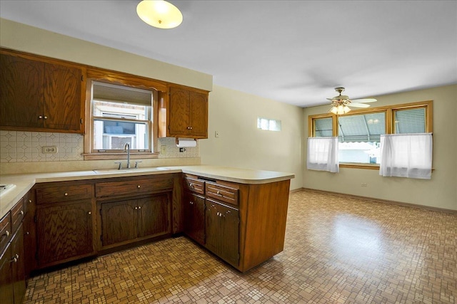 11340 S Drake Ave, Chicago, IL 60655 - kitchen featuring a peninsula, light countertops, tasteful backsplash, and a ceiling fan