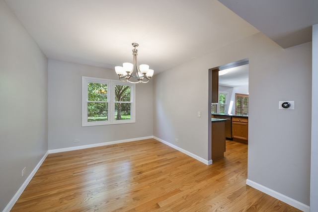 27W098 Walnut Dr, Winfield, IL 60190 - empty room with a chandelier and light wood-type flooring