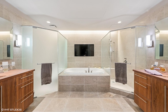 401 N Wabash Ave Unit 33K, Chicago, IL 60611 - full bath with a bath, vanity, a stall shower, tile walls, and recessed lighting