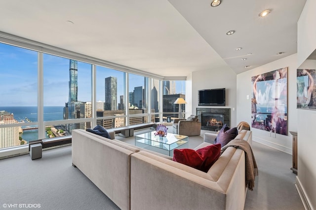 401 N Wabash Ave Unit 33K, Chicago, IL 60611 - carpeted living room featuring a lit fireplace, healthy amount of natural light, a water view, and recessed lighting