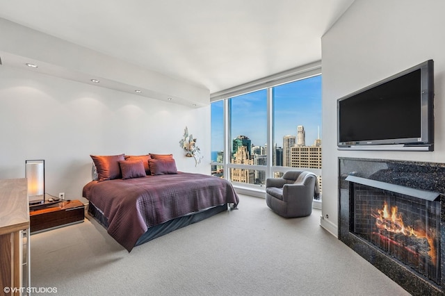 401 N Wabash Ave Unit 33K, Chicago, IL 60611 - bedroom with carpet, a fireplace, a wall of windows, and recessed lighting
