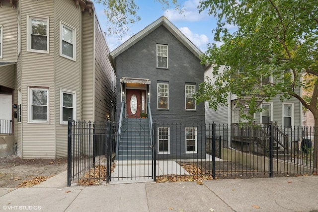 2076 N Campbell Ave, Chicago, IL 60647 - view of front of house with a fenced front yard and a gate