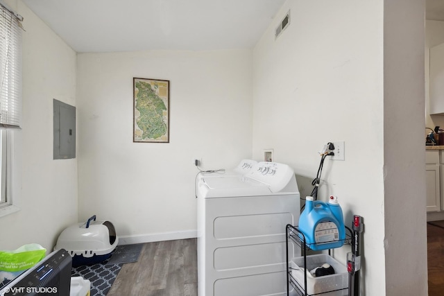 2076 N Campbell Ave, Chicago, IL 60647 - laundry area featuring electric panel, wood finished floors, and washing machine and dryer