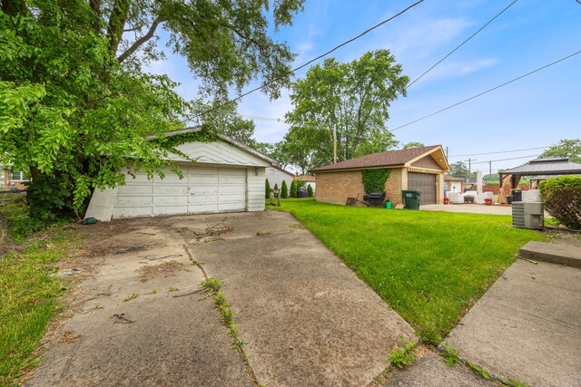 15620 Ingleside Ave, Dolton, IL 60419 - view of front of property featuring a detached garage, an outbuilding, a front yard, a gazebo, and brick siding