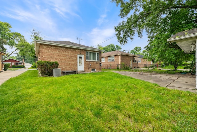15620 Ingleside Ave, Dolton, IL 60419 - rear view of house featuring a lawn and brick siding
