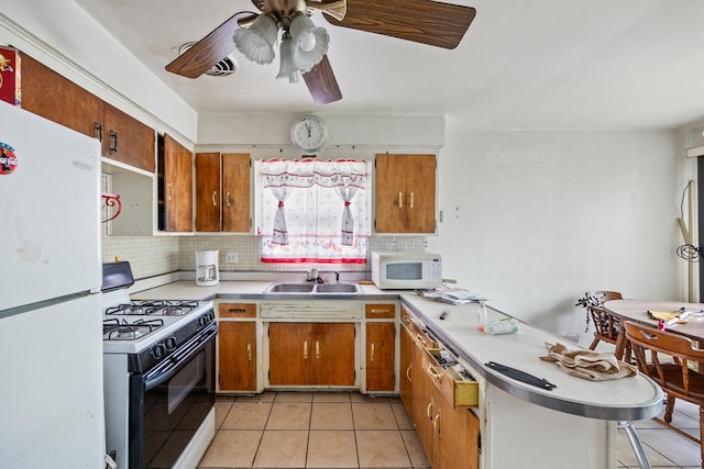 15620 Ingleside Ave, Dolton, IL 60419 - kitchen featuring white appliances, light countertops, and brown cabinets