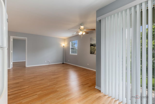 557 E Shag Bark Ln Unit H, Streamwood, IL 60107 - spare room featuring ceiling fan and light wood-type flooring