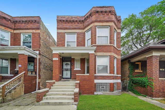 1516 E 74th Pl, Chicago, IL 60619 - multi unit property featuring brick siding and a front lawn