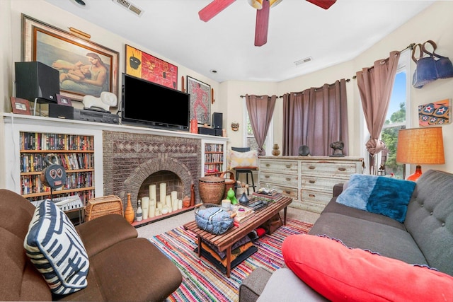 1516 E 74th Pl, Chicago, IL 60619 - living area with a ceiling fan, a brick fireplace, and carpet flooring
