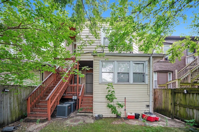 1516 E 74th Pl, Chicago, IL 60619 - rear view of property with stairway and a fenced backyard