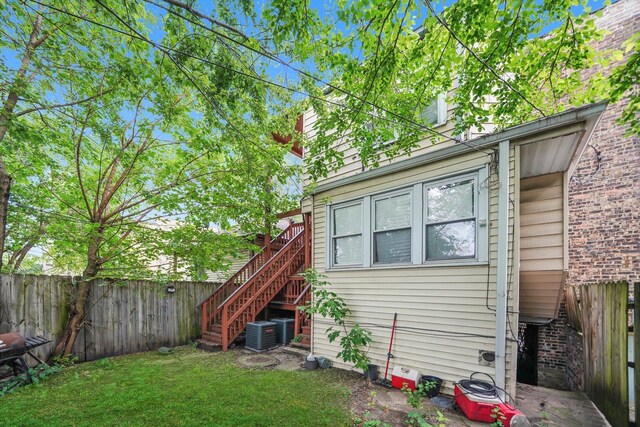 1516 E 74th Pl, Chicago, IL 60619 - back of property with stairway and a fenced backyard