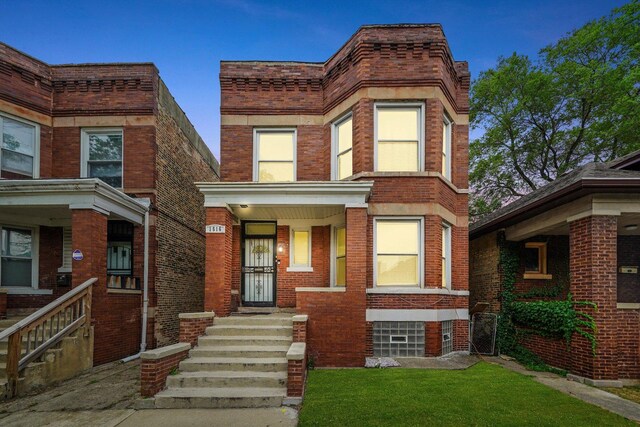 1516 E 74th Pl, Chicago, IL 60619 - view of front of house with brick siding and a front yard