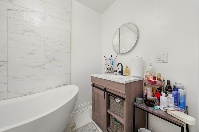 1516 E 74th Pl, Chicago, IL 60619 - bathroom featuring marble finish flooring, a freestanding bath, and vanity