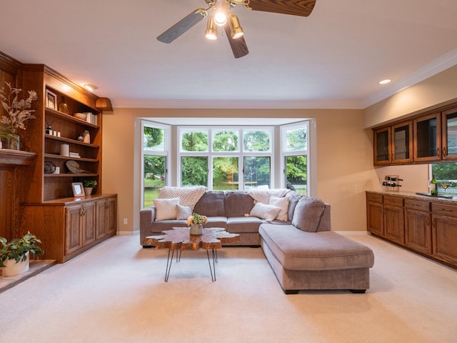 15955 Raintree Rd, Bloomington, IL 61705 - living area with ornamental molding, light carpet, plenty of natural light, and ceiling fan