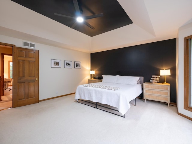 15955 Raintree Rd, Bloomington, IL 61705 - carpeted bedroom featuring a raised ceiling and a ceiling fan