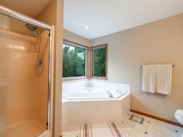 15955 Raintree Rd, Bloomington, IL 61705 - bathroom featuring a stall shower, tile patterned floors, a bath, and recessed lighting