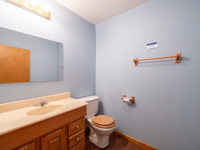 15955 Raintree Rd, Bloomington, IL 61705 - bathroom featuring wood finished floors and vanity