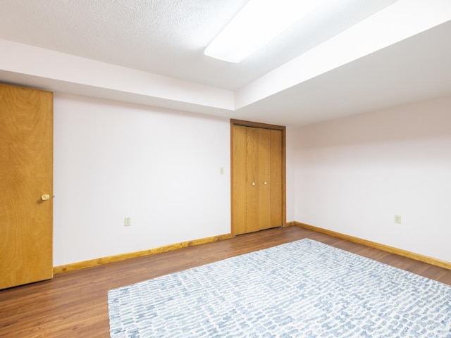 15955 Raintree Rd, Bloomington, IL 61705 - empty room with baseboards and wood finished floors