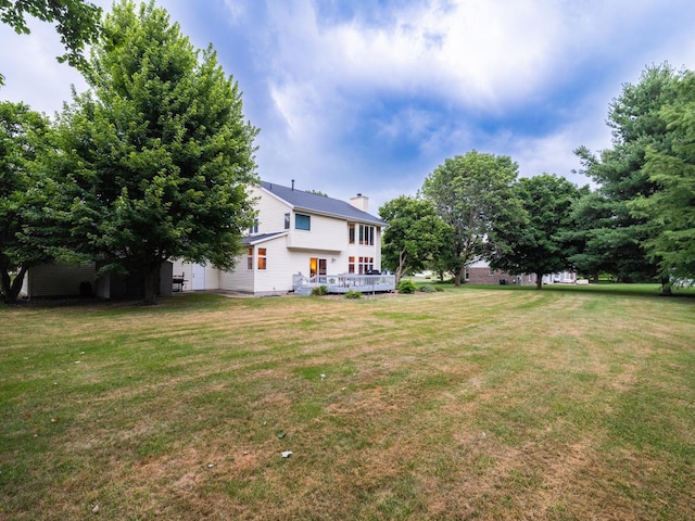 15955 Raintree Rd, Bloomington, IL 61705 - view of green lawn with a deck