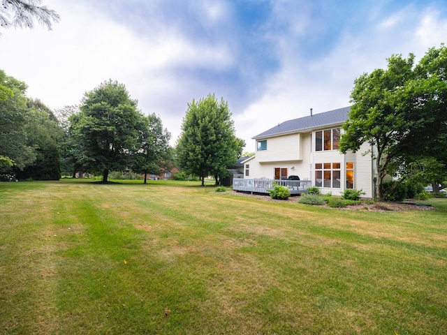 15955 Raintree Rd, Bloomington, IL 61705 - view of green lawn featuring a wooden deck
