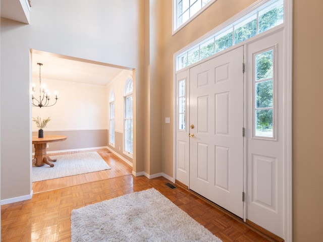 15955 Raintree Rd, Bloomington, IL 61705 - entrance foyer with a chandelier, healthy amount of natural light, and a towering ceiling