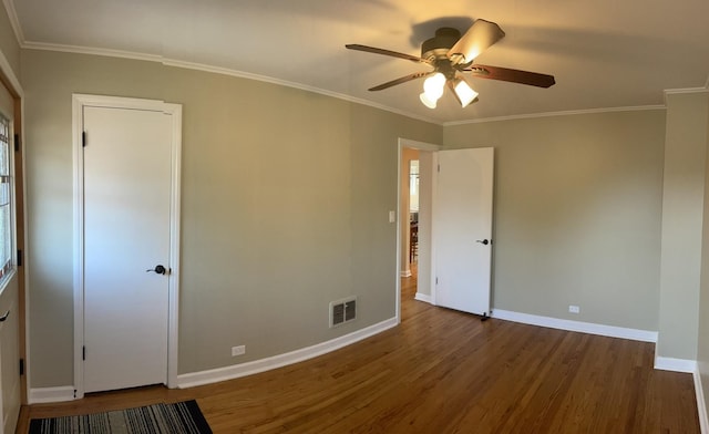 7641 W Hortense Ave, Chicago, IL 60631 - spare room with wood finished floors, a ceiling fan, and ornamental molding