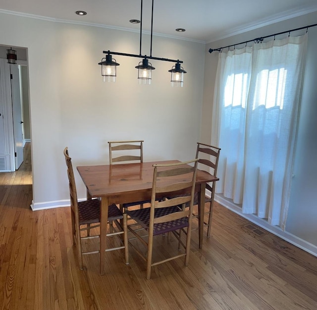 7641 W Hortense Ave, Chicago, IL 60631 - dining area featuring ornamental molding, wood finished floors, and recessed lighting