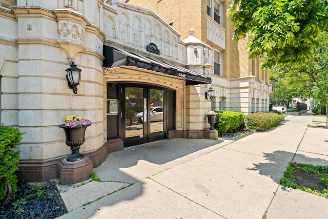4240 N Clarendon Ave Unit 405S, Chicago, IL 60613 - view of exterior entry featuring french doors and stone siding