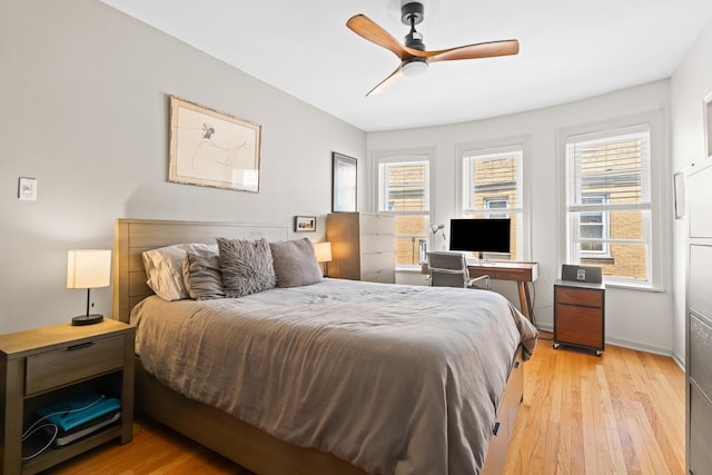 4240 N Clarendon Ave Unit 405S, Chicago, IL 60613 - bedroom with light wood-style floors, multiple windows, and a ceiling fan