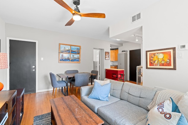 4240 N Clarendon Ave Unit 405S, Chicago, IL 60613 - living room featuring light wood-style floors, a ceiling fan, and rail lighting