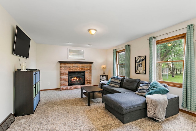 219 N Nina St, Cortland, IL 60112 - living room with a brick fireplace and light colored carpet