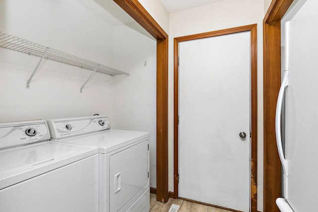 219 N Nina St, Cortland, IL 60112 - laundry room featuring washer and dryer and light wood-type flooring