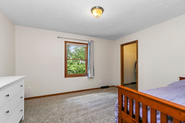 219 N Nina St, Cortland, IL 60112 - carpeted bedroom with baseboards and a textured ceiling