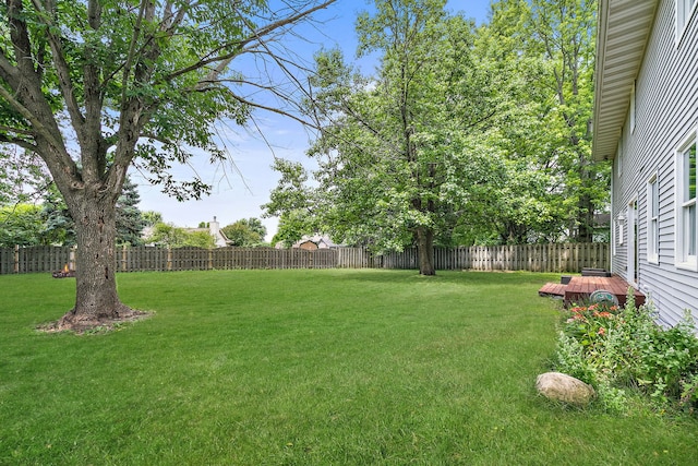 219 N Nina St, Cortland, IL 60112 - fenced backyard with a wooden deck