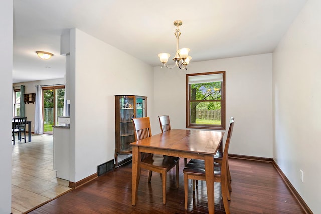 219 N Nina St, Cortland, IL 60112 - dining space featuring a chandelier and wood finished floors