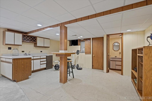 978 Merrimac Cir, Naperville, IL 60540 - kitchen featuring a paneled ceiling, light countertops, and a kitchen bar