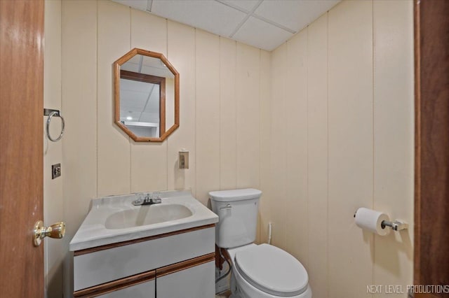 978 Merrimac Cir, Naperville, IL 60540 - half bath featuring vanity, a paneled ceiling, and a decorative wall