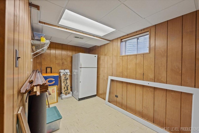 978 Merrimac Cir, Naperville, IL 60540 - below grade area with freestanding refrigerator, wood walls, and a drop ceiling