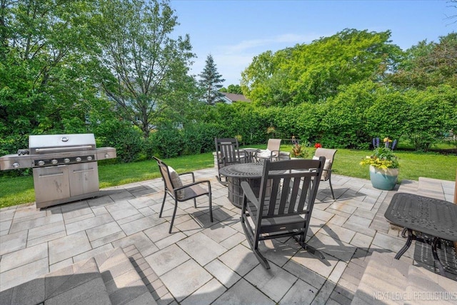 978 Merrimac Cir, Naperville, IL 60540 - view of patio with outdoor dining area, a grill, and view of wooded area