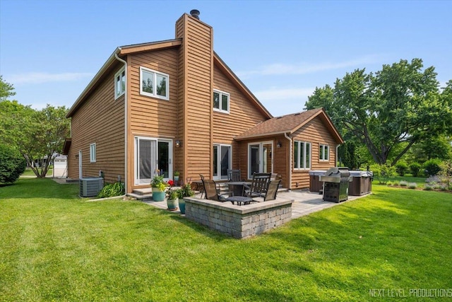 978 Merrimac Cir, Naperville, IL 60540 - back of property featuring a chimney, a patio area, entry steps, and a yard