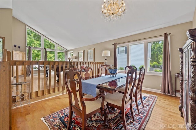 978 Merrimac Cir, Naperville, IL 60540 - dining space with light wood finished floors, plenty of natural light, a chandelier, and lofted ceiling