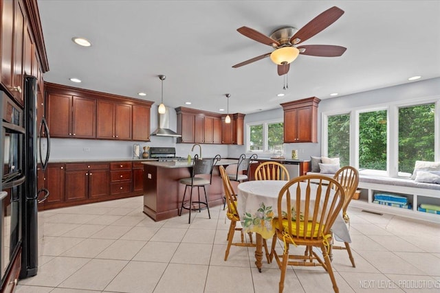 978 Merrimac Cir, Naperville, IL 60540 - kitchen with wall chimney range hood, recessed lighting, a breakfast bar, stainless steel range oven, and an island with sink