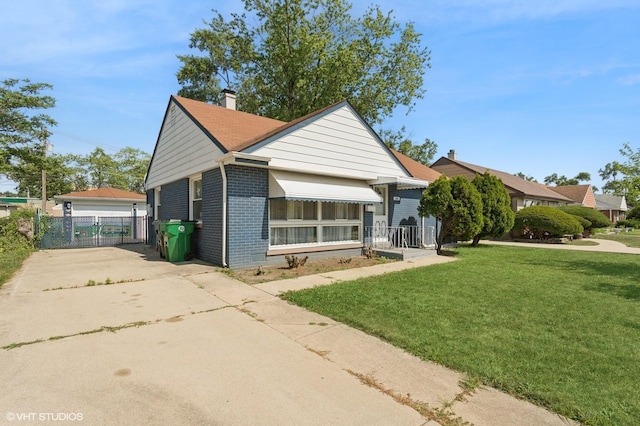 1113 Bristol Ave, Westchester, IL 60154 - view of front of home featuring brick siding, driveway, a gate, and a chimney