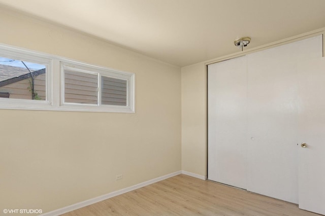1113 Bristol Ave, Westchester, IL 60154 - unfurnished bedroom with light wood-style flooring and a closet