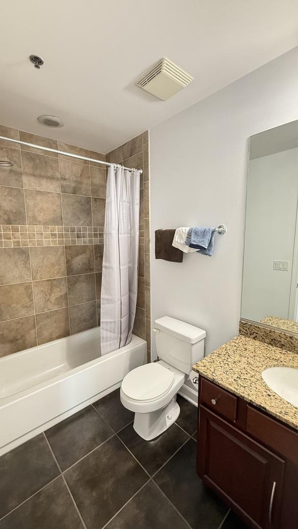 1841 S Calumet Ave Unit 2102, Chicago, IL 60616 - bathroom with tile patterned flooring, vanity, and shower / bathtub combination with curtain